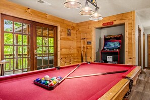 A pool table with balls and cues, a game room sign, and a pool table with a red felt surface. - 5 Mins to Pigeon Forge! Hot Tub*Game Room*Fire Pit (Pigeon Forge)