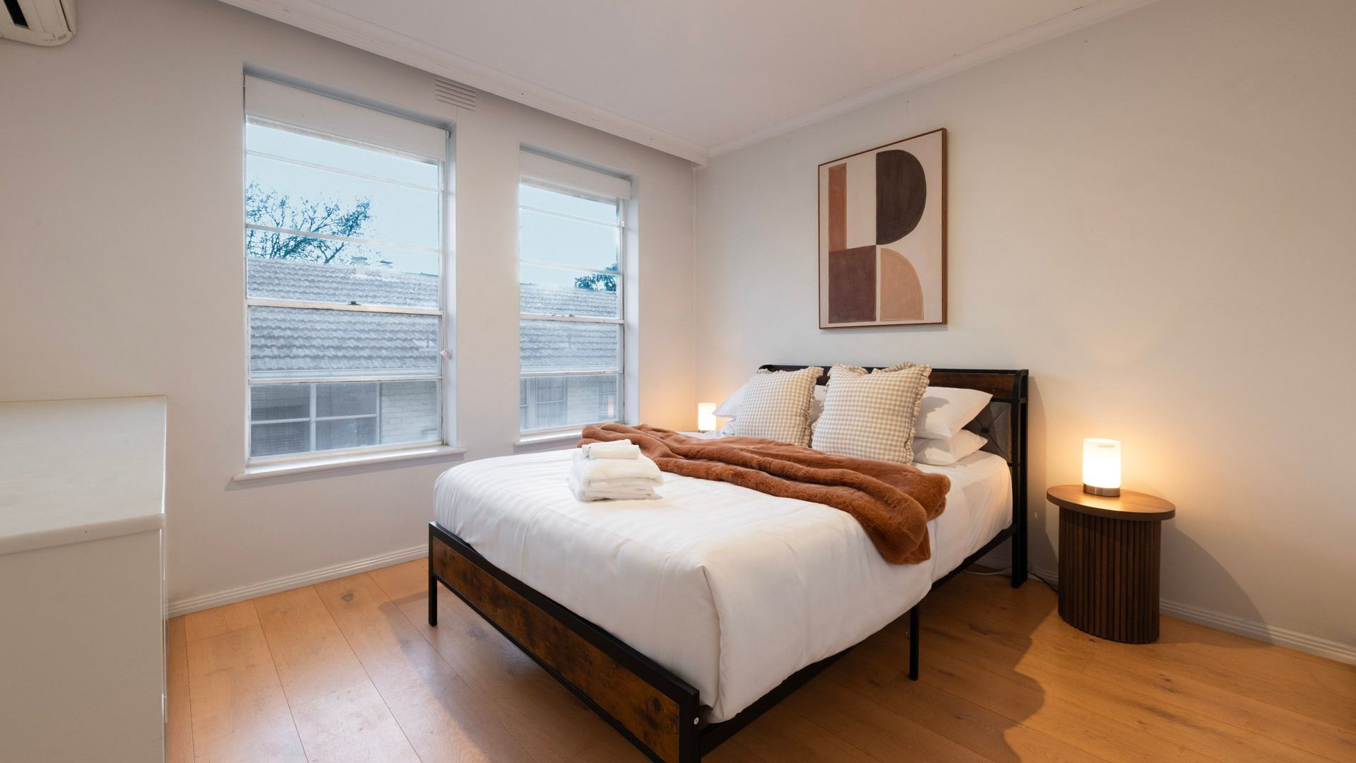 Drift off in the beautifully styled master bedroom with soft ambient lighting.