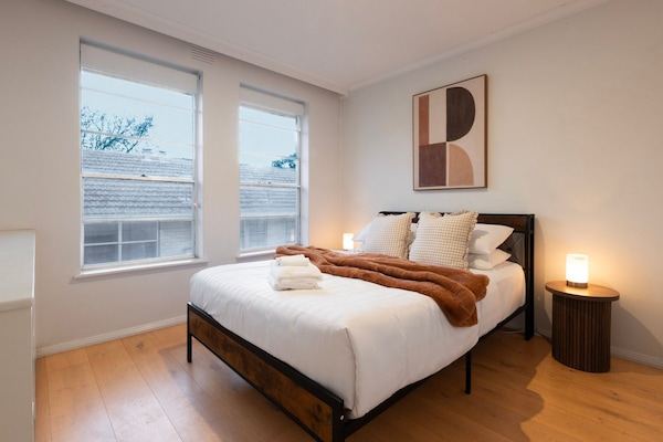 Drift off in the beautifully styled master bedroom with soft ambient lighting.