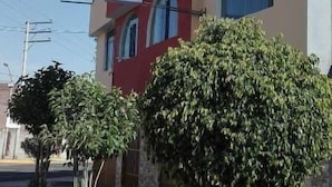 A multi-story building with a sign that reads 'HOSTAL ORI.' - Qori Arequipa (Arequipa)