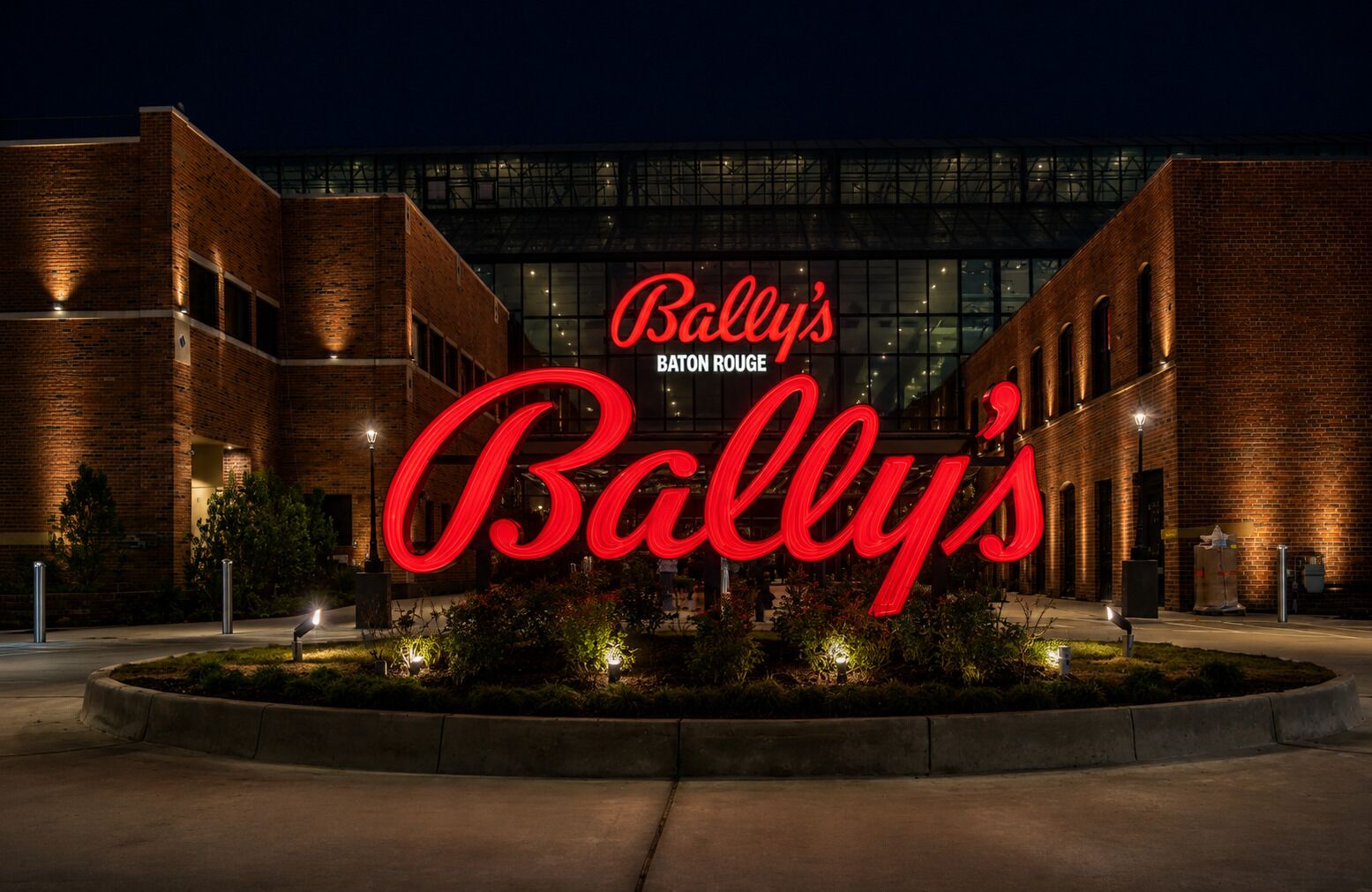 A building with a prominent red sign reading 'Bally's Baton Rouge.'