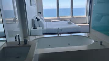 Deluxe Apartment, Beach View | In-room safe, blackout curtains, iron/ironing board, free WiFi