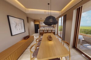 A modern dining area with a wooden table and chairs, a pendant light, and a view of the outdoors. - Inna Resort & Spa (Puerto Morelos)
