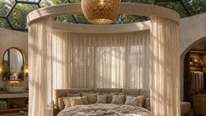A circular bed with a canopy, a round rug, and a hanging light fixture in a room with a geometric ceiling and a view of greenery outside. - Private 75-Acre Dome Estate: Waterfall, Farm, Trails & Pacific Views (Platanillo)