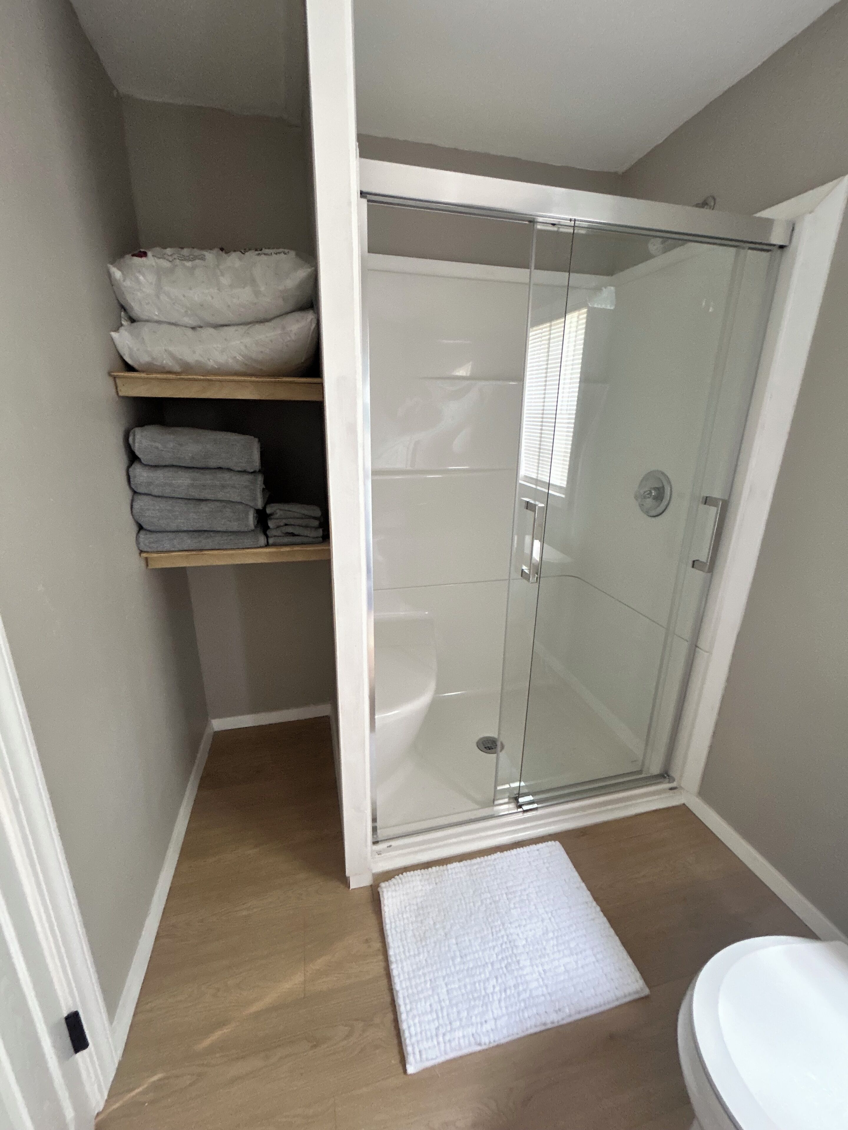 Shower, hair dryer, towels, soap