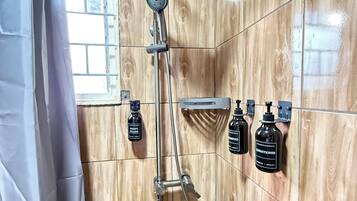Shower, towels, soap, toilet paper