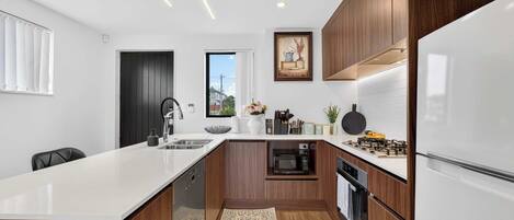 Coffee/tea maker, fridge, microwave, oven