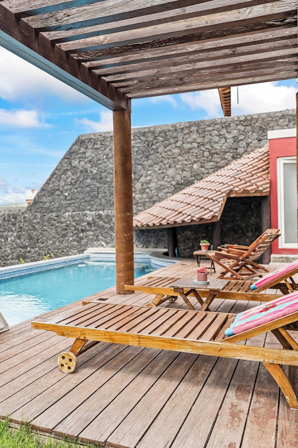 Outdoor pool, pool umbrellas, sun loungers