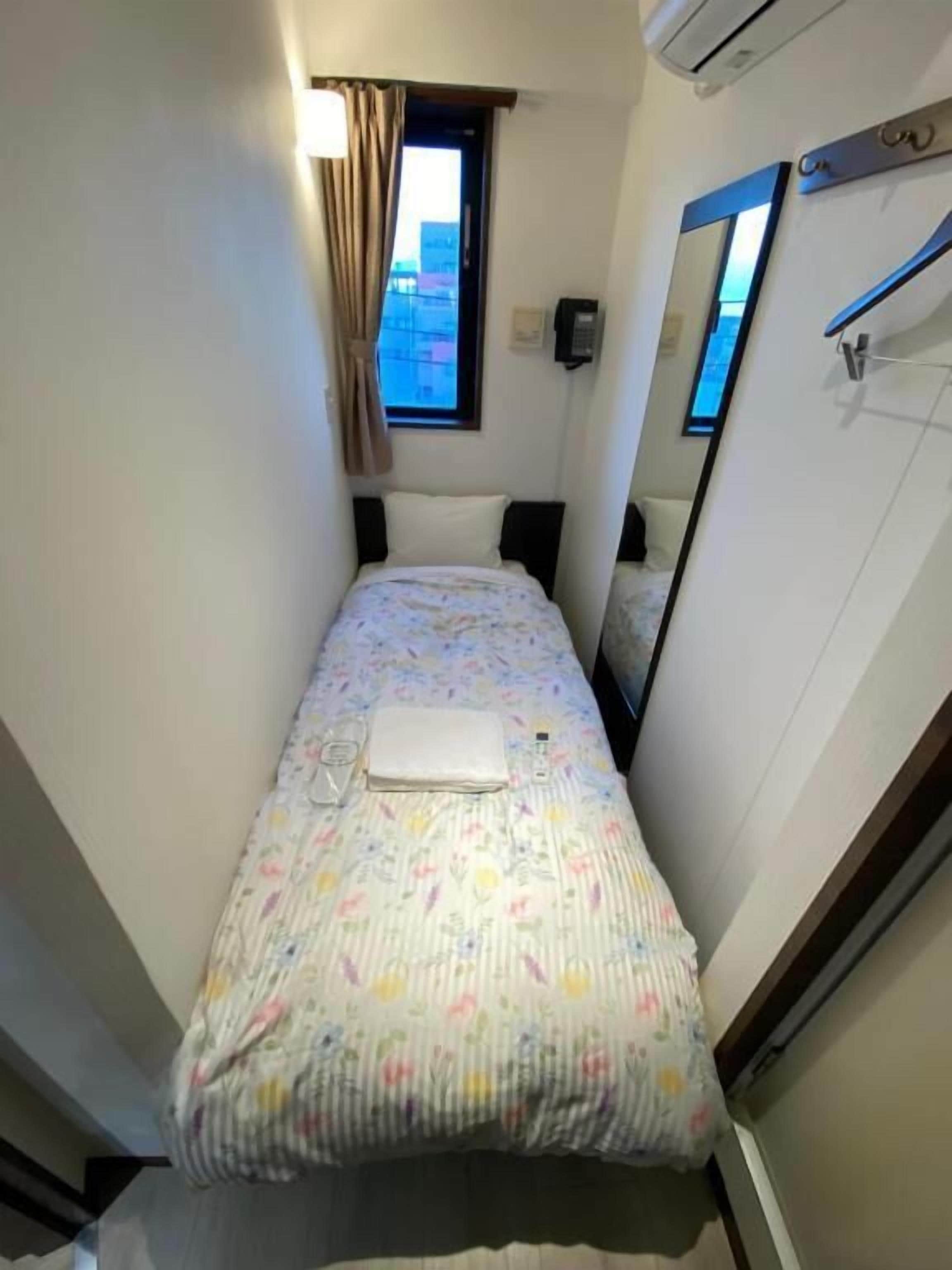 Habitación individual económica, vistas a la ciudad | Cortinas opacas y sistema de insonorización