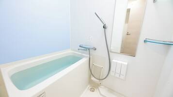 Separate tub and shower, hair dryer, towels, shampoo