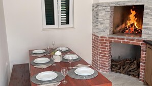A dining table set with plates, glasses, and a centerpiece. - Apartment With Balcony And Parking 2, Okrug Gornji, Croatia (Okrug Gornji)