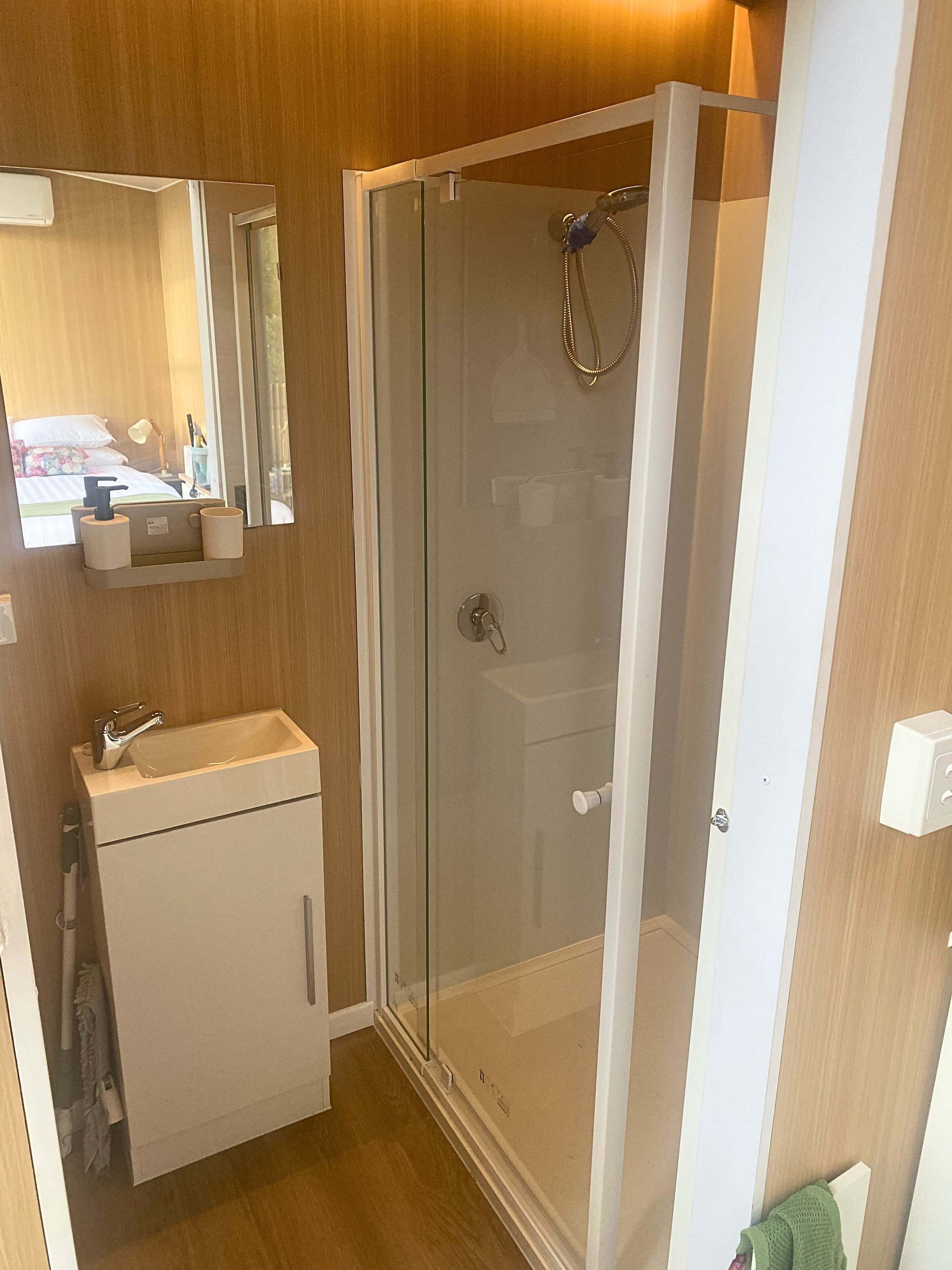 Shower, hair dryer, towels, shampoo