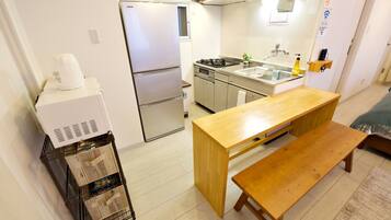 Apartment | Private kitchen | Full-size fridge, microwave, stovetop, cookware/dishes/utensils