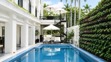 Outdoor pool, open 9:00 AM to 9:00 PM, pool umbrellas, pool loungers