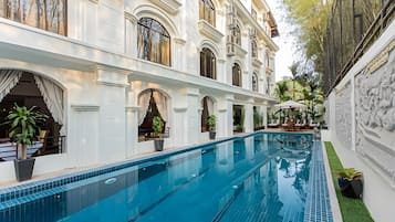 Outdoor pool, open 9:00 AM to 9:00 PM, pool umbrellas, pool loungers
