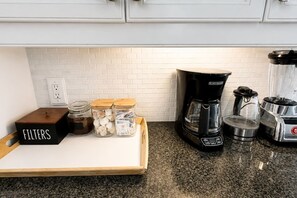 Coffee/tea maker, fridge, microwave, oven