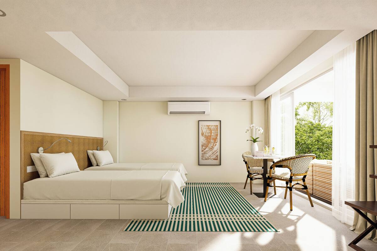 Villa familiar, vista al mar | Edredón, minibar, caja de seguridad en la habitación y escritorio 