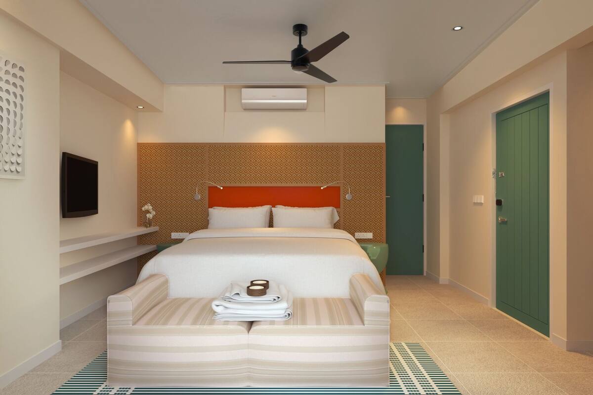 Casa Deluxe, vista al mar | Edredón, minibar, caja de seguridad en la habitación y escritorio 