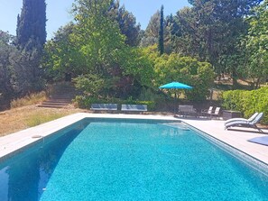 A rectangular swimming pool with clear blue water, surrounded by a tiled deck. - Les Sources by Interhome (Draguignan)