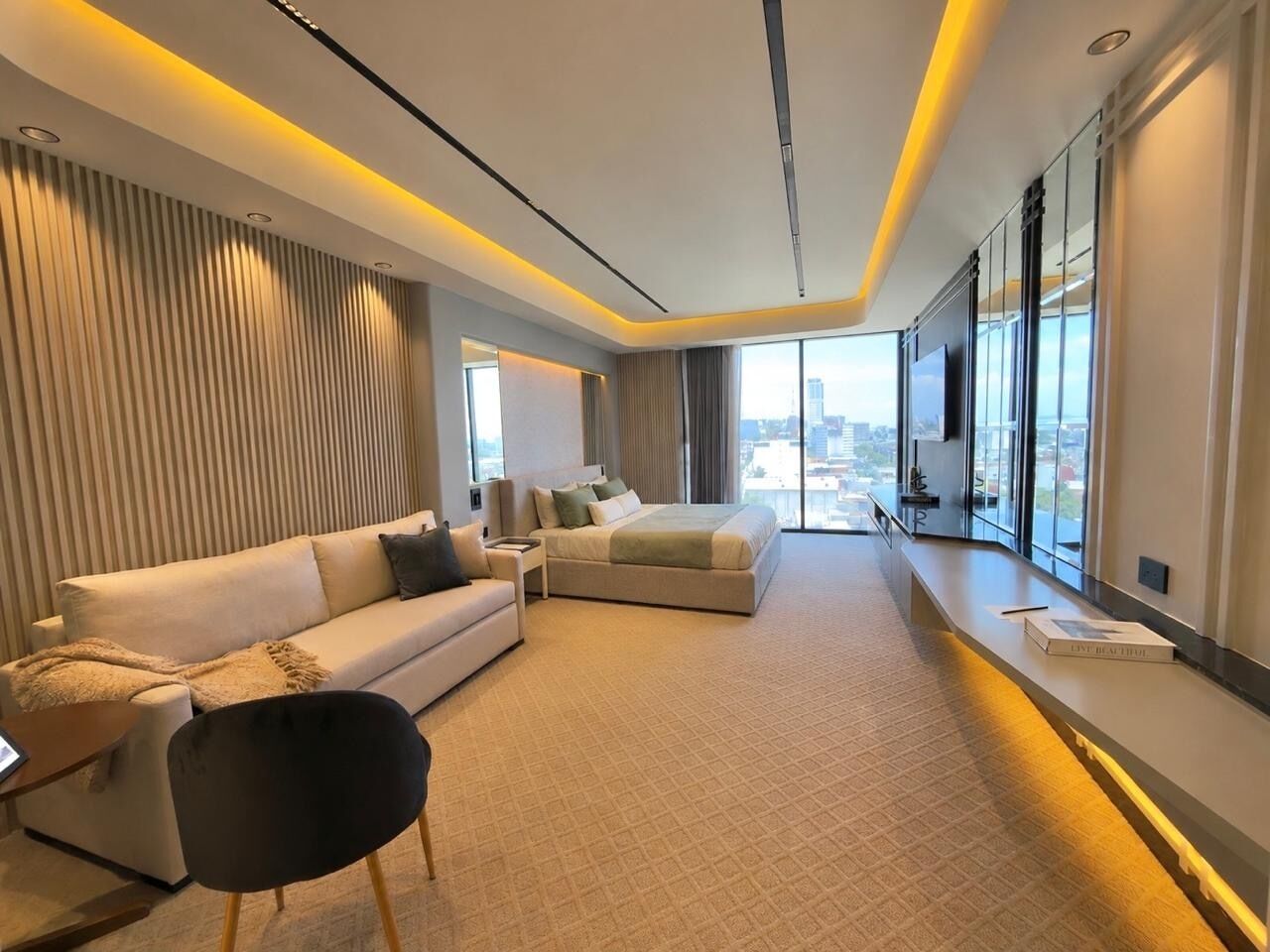 Suite Deluxe, vista a la ciudad | Área de sala de estar