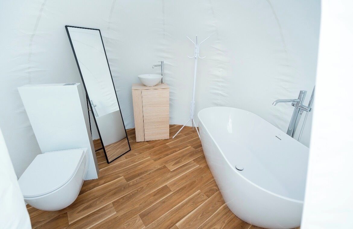 Bathtub, hair dryer, towels, toilet paper