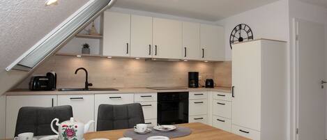 Coffee/tea maker, fridge, microwave, oven