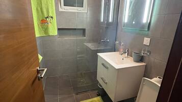 Shower, bidet, towels, soap