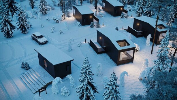 Ein moderner, verschneiter Chaletkomplex mit mehreren Gebäuden, jedes mit großen Fenstern und minimalistischem Design.