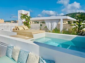 A rooftop pool area with a seating area and a pergola. - Stunning 3-bedroom penthouse with private pool in charming Jesús with AC parkin (Jesús)
