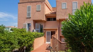 A two-story building with a flat roof and a balcony. - GuestHost - Palau Comfy Flat with Balcony (Palau)