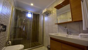 Shower, hair dryer, slippers, towels