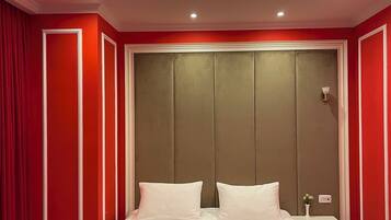 Deluxe Room, City View | In-room safe, desk, laptop workspace, blackout drapes