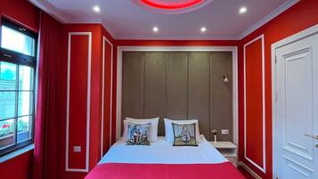 Deluxe Room, City View | In-room safe, desk, laptop workspace, blackout drapes