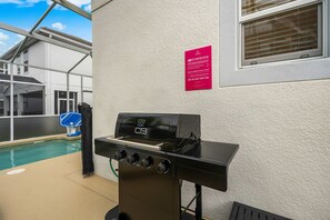 A barbecue grill with a control panel, a basketball hoop, and a pool. - 1576 Flange Drive (Davenport)