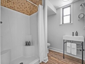 A bathroom with a shower, toilet, and sink. - Sabel #002 | Asheville Queen Suite w/ Kitchenette Near Downtown & Biltmore (Asheville)