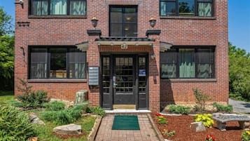 A brick building with a sign reading 'SABEL' and a door labeled '42'.
