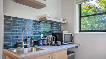 Coffee/tea maker, fridge, microwave, cookware/dishes/utensils