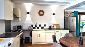 Coffee/tea maker, fridge, microwave, oven