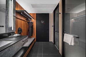 A modern bathroom with a wooden vanity, a mirror, and a towel rack. - Intercity Hotel Shanghai Expo Center Branch (Shanghai)