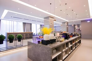 A modern hotel lobby with a marble reception desk, pendant lighting, and a large window with curtains. - Home Inn Selected (Shanghai)