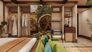 Un dormitorio con cama, sofá verde, armario, escritorio y pared con mosaico.
