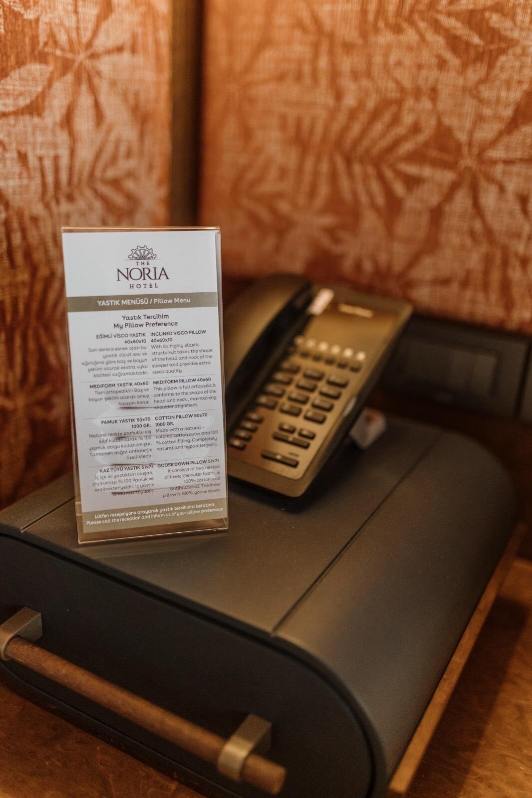 A pillow menu from The Noria Hotel detailing pillow preferences and types.