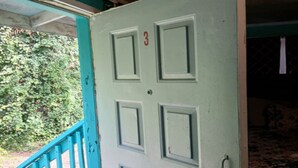 A door with four panels, a number '3' above the middle panel, and a handle on the right side. - Cozy 1BR Fort Myers Getaway – Minutes to Downtown! (Fort Myers)