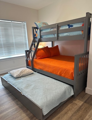 A bunk bed with a lower level bed and a staircase. - 158 E Garfield Ave  Unit 106 Wildwood, NJ (Wildwood)