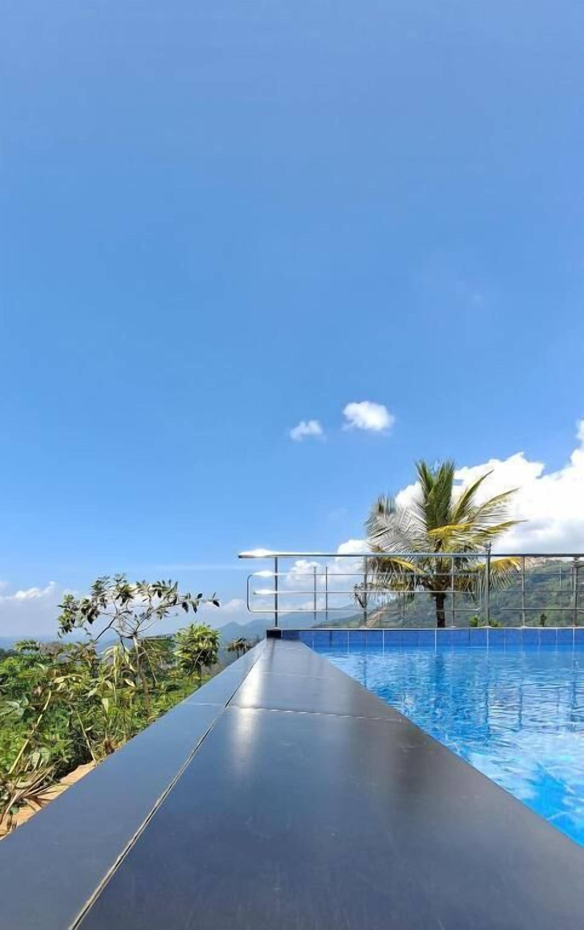 Outdoor pool, open 9:00 AM to 9:00 PM, pool umbrellas