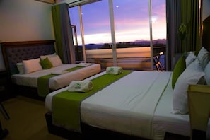 A hotel room with two beds, a large window with a view of the mountains, and a balcony. - Nelinsa Wellness Resort & Spa (Matale)