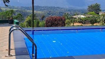 Family Quadruple Room, Balcony, Garden View | Pool | Outdoor pool, open 9:00 AM to 9:00 PM, pool umbrellas