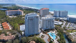 A resort with multiple high-rise buildings, a swimming pool, and a beach view. - 4th-Floor Studio | Walk to Beach | Pool, Beach Tram | Luau II 6421, Sandestin (Miramar Beach)