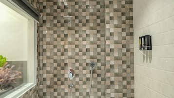 Suite, Non Smoking, Air conditioning | Bathroom | Shower, free toiletries, hair dryer, towels