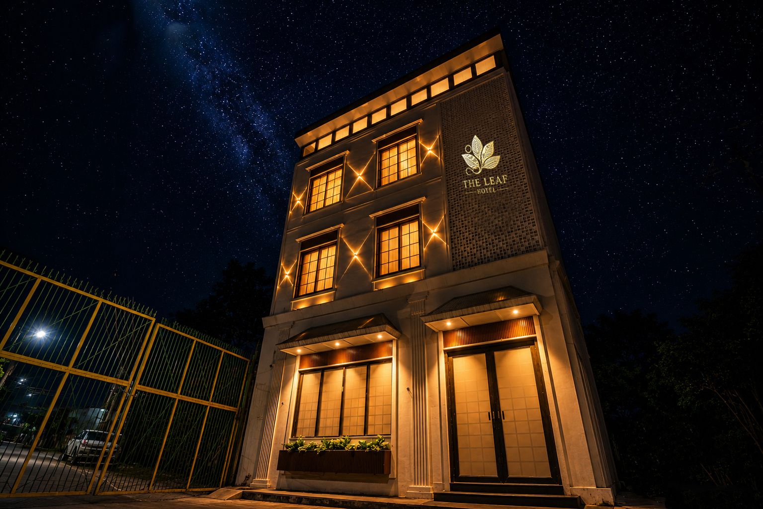 A hotel with a modern facade, multiple windows, and a sign indicating it is 'The Leaf Hotel'.